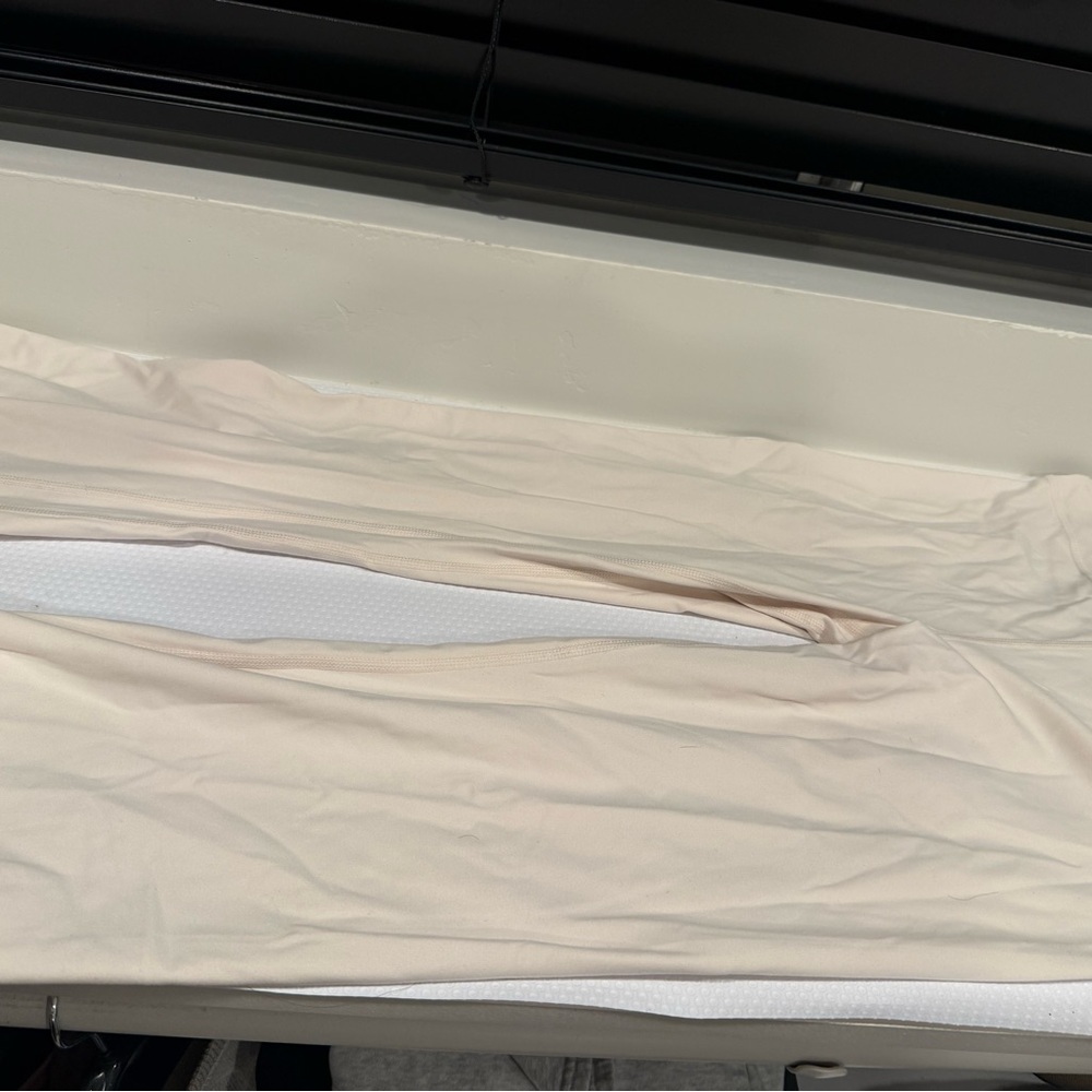 Cream colored high waisted/fold over flare leggings!